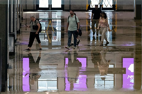 People walk through the flooded Union Station